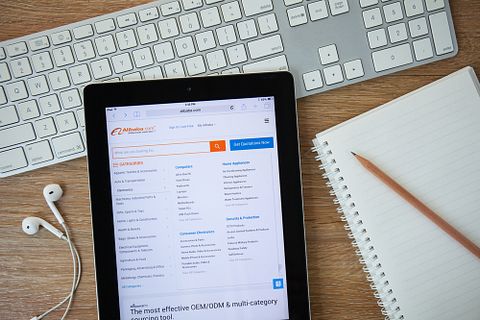 Alibaba Group Holding Ltd (NYSE:BABA), Alibaba homepage on a Ipad monitor screen, webiste, group, online