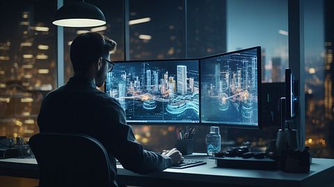 A graphic designer in front of a computer rendering a cutting edge digital advertisement for the company.